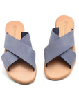 Theluto Gaelle blue leather slip-on sandals with a crisscross strap design and cushioned tan footbed.