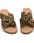 Theluto Gaelle Cheetah slip-on sandals featuring premium leopard-print leather crisscross straps and cushioned soles.
