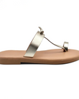 Theluto Heloïse handmade gold leather toe-ring sandals with a flat sole, crafted ethically in Greece.