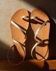 Theluto Lilou glitter sandals in gold leather with a toe loop design, handcrafted in Greece.