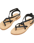 Theluto Marie black leather strappy sandals with a minimalist thong design and adjustable ankle strap