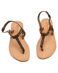 Theluto Meloe Cheetah leather sandals with leopard print straps, ankle ties, and a natural tan leather sole.