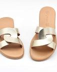 Theluto Prune slip-on sandals in metallic gold leather with a chic minimalist design, handmade in Greece.