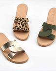 Theluto Prune handmade leather slip-on sandals in leopard print, olive green, and metallic gold on white background