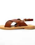 Theluto Tom brown leather sandals with minimalist crisscross straps and a side buckle on a lightweight sole