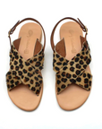 Theluto Tom Cheetah sandals featuring crisscross leopard print hair-on-hide leather straps and tan leather footbeds.