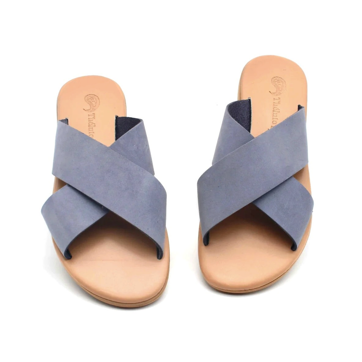 Theluto Gaelle blue leather slip-on sandals with a crisscross strap design and cushioned tan footbed.