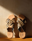 Theluto Gaelle Cheetah slip-on sandals featuring premium leopard-print leather cross straps and a cushioned sole.