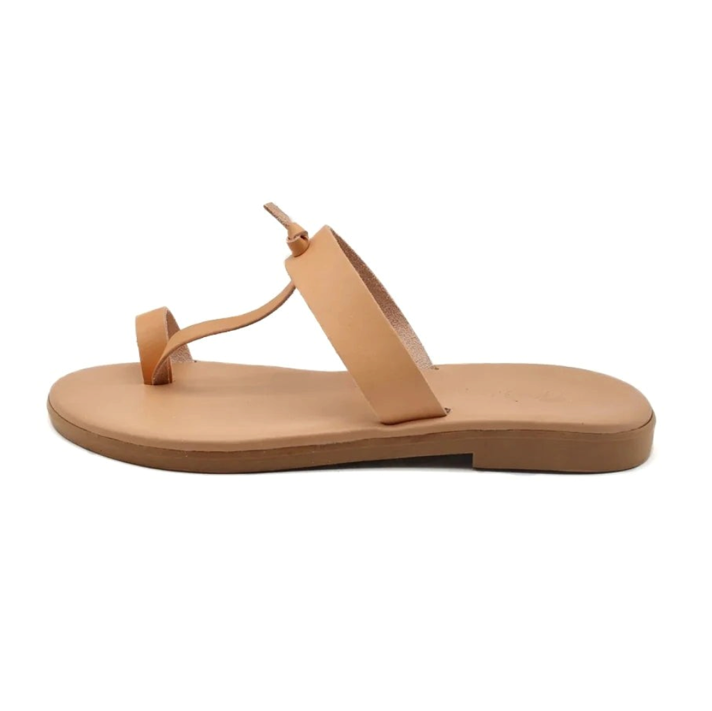 Theluto Héloïse handmade tan leather toe-ring sandals with a minimalist flat design, crafted in Greece.