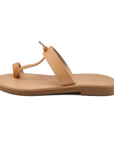 Theluto Héloïse handmade tan leather toe-ring sandals with a minimalist flat design, crafted in Greece.