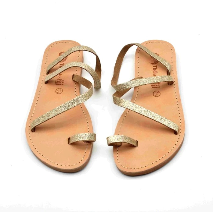 Theluto Lilou glitter sandals in gold, handcrafted from natural leather with a comfortable toe-loop design.
