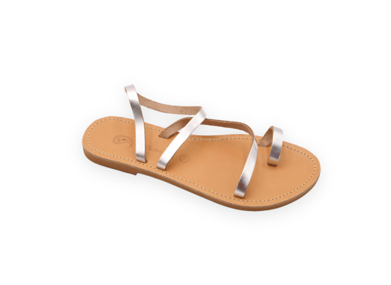 Theluto Lilou handcrafted Greek leather sandals in metallic silver with a minimalist toe-loop design.