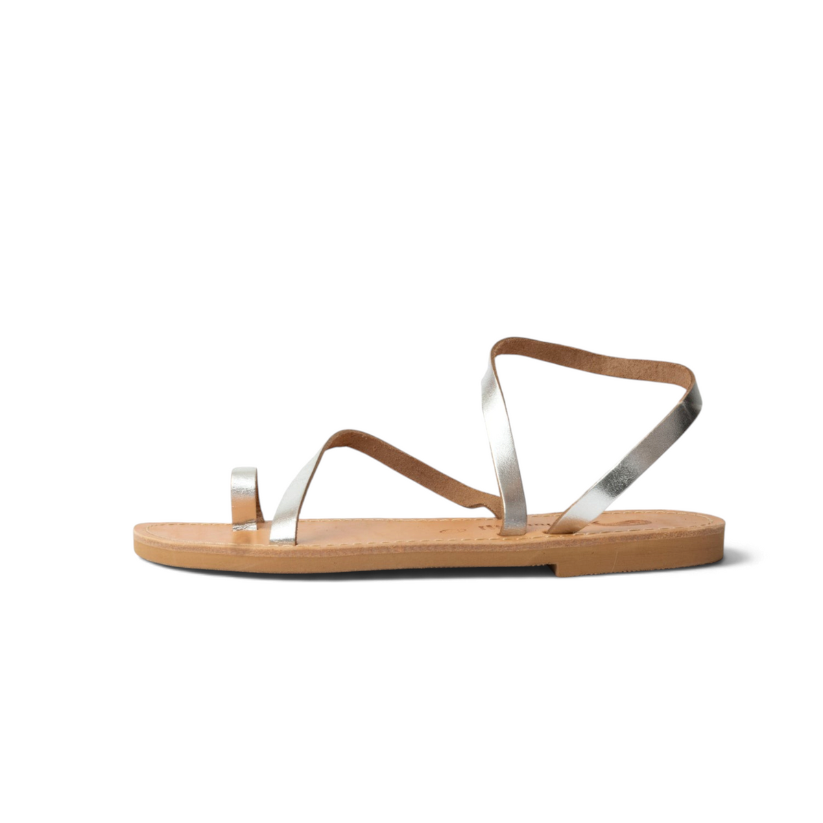 Theluto Lilou handcrafted Greek leather sandals in metallic silver with a minimalist toe-ring and ankle strap design.
