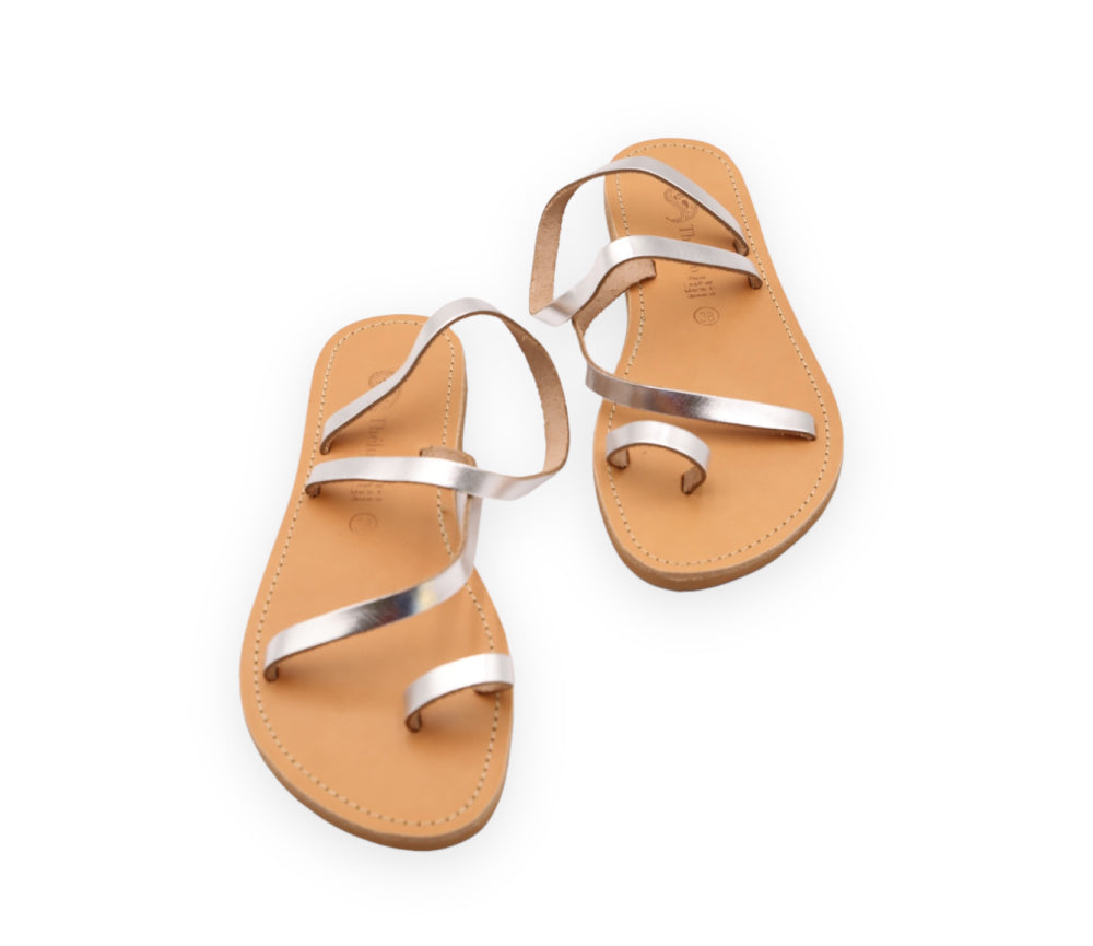 Theluto Lilou handcrafted Greek leather sandals in metallic silver with a minimalist toe-loop design