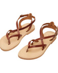 Theluto Marie brown leather strappy sandals with a minimalist thong design and adjustable ankle buckle strap