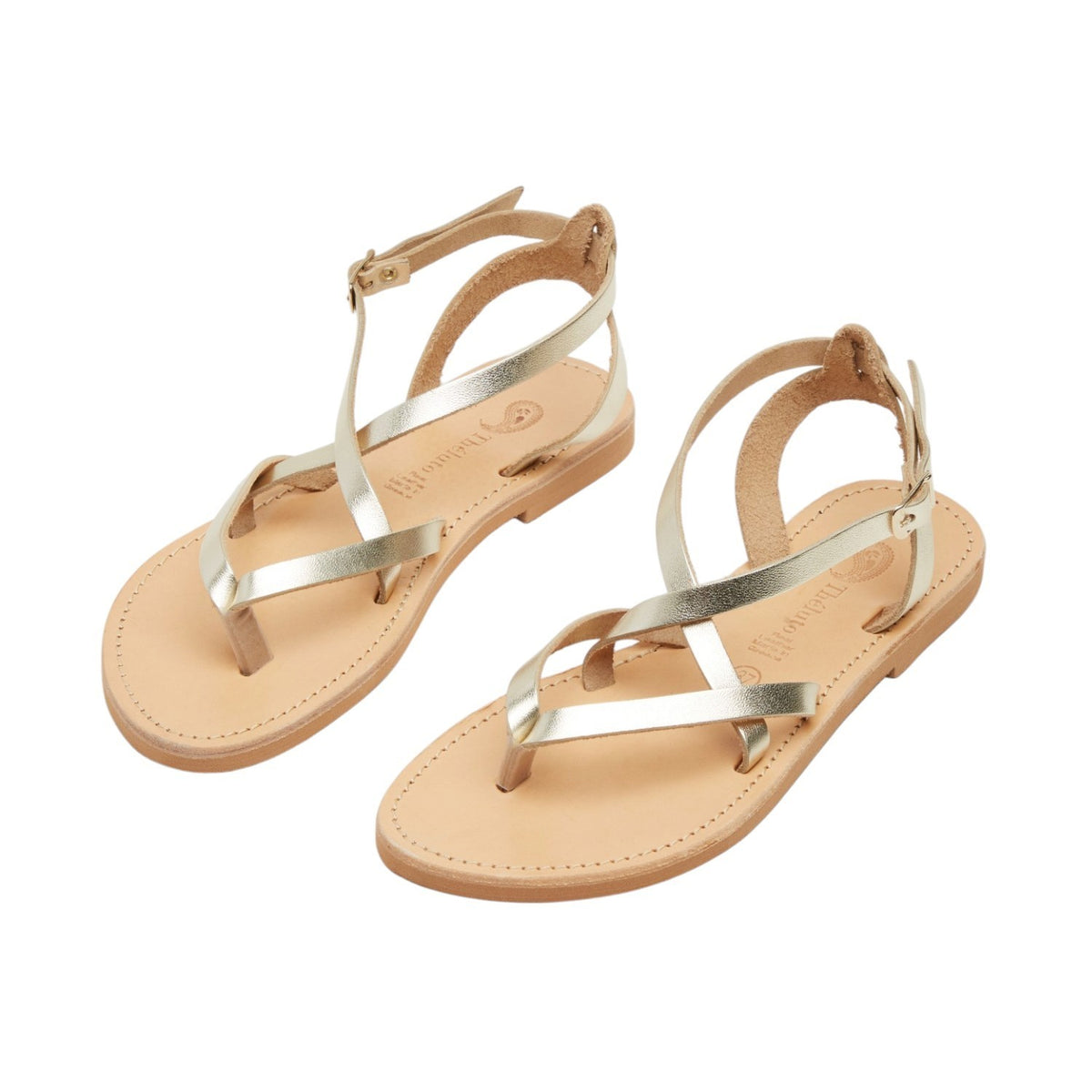Theluto Marie gold leather thong sandals with minimalist ankle straps and flat soles for summer wear