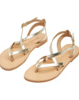 Theluto Marie gold leather thong sandals with minimalist ankle straps and flat soles for summer wear