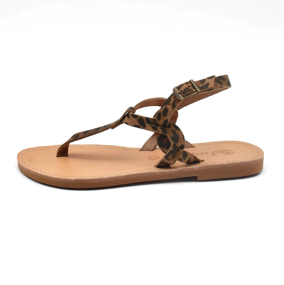 Theluto Meloe Cheetah leather thong sandal with leopard print straps, ankle buckle, and flat tan leather sole.