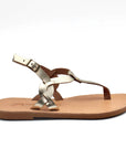 Theluto Meloe gold leather thong sandal with braided straps and an adjustable ankle buckle on a flat leather sole