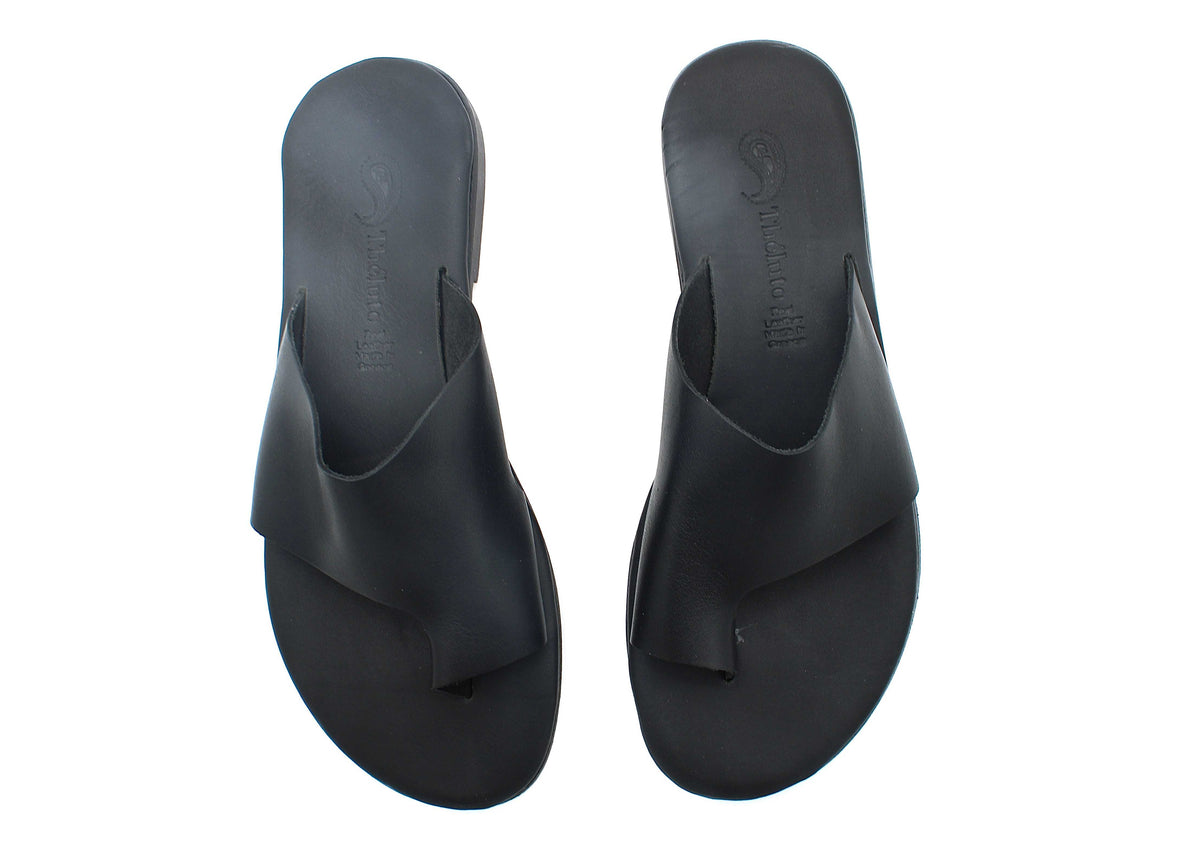 Theluto Mykonos black leather slip-on sandals with a comfortable toe-loop design for summer wear.