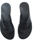 Theluto Mykonos black leather slip-on sandals with a comfortable toe-loop design for summer wear.