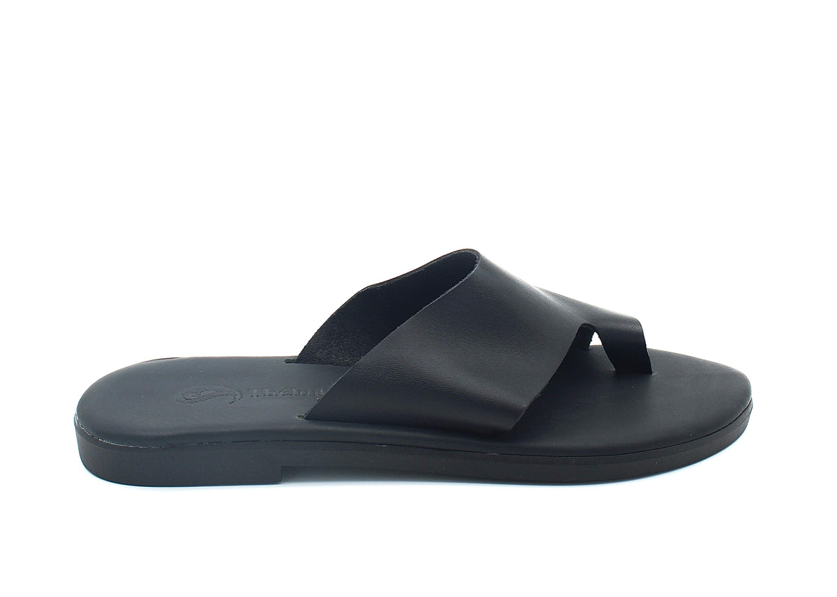 Theluto Mykonos black leather toe-loop slide sandal with a minimalist slip-on design and reinforced sole.