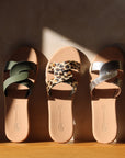 Theluto Prune Cheetah slip-on sandals featuring a leopard print leather strap and natural leather sole.