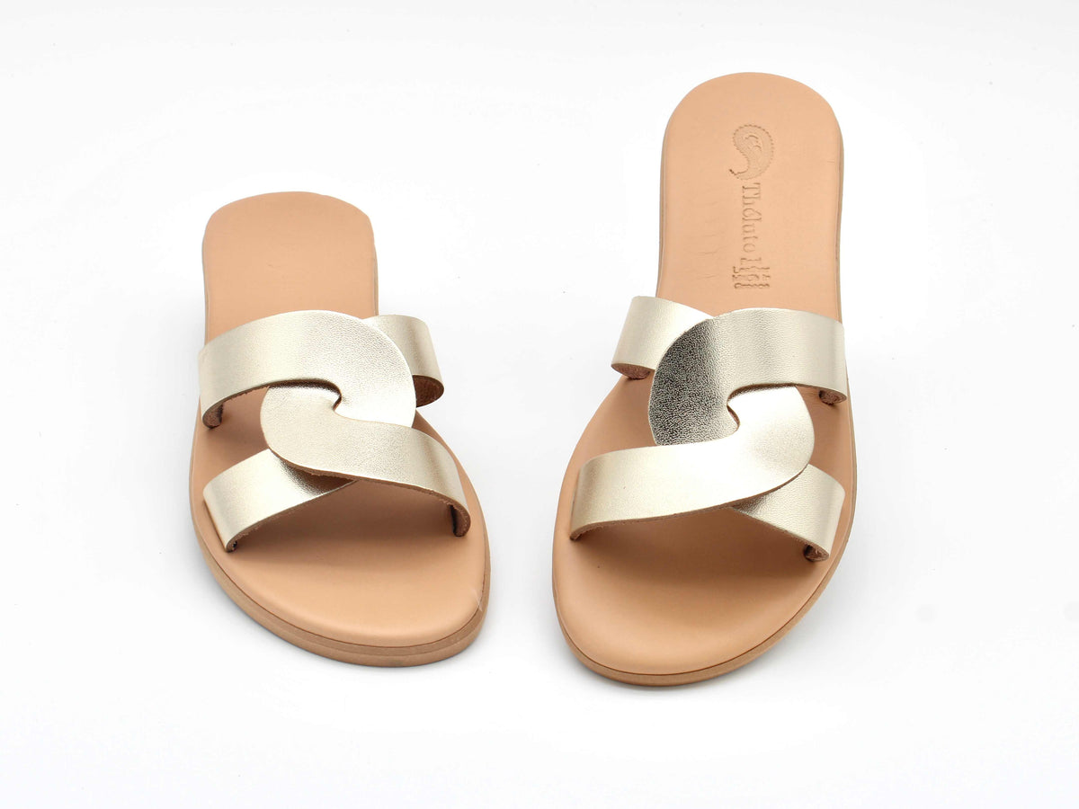 Theluto Prune slip-on sandals in metallic gold leather with a chic minimalist design, handmade in Greece.