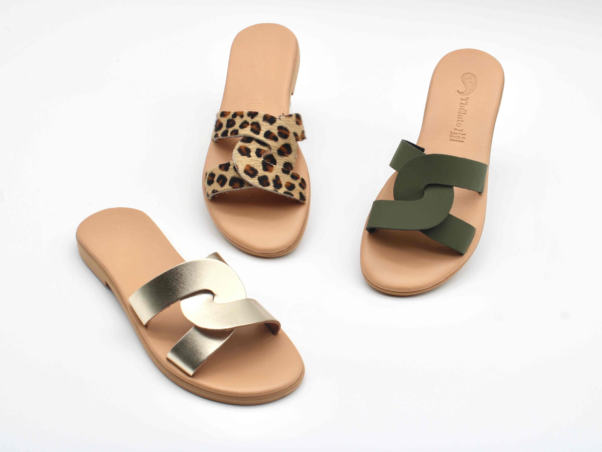 Theluto Prune handmade leather slip-on sandals in leopard print, olive green, and metallic gold on white background