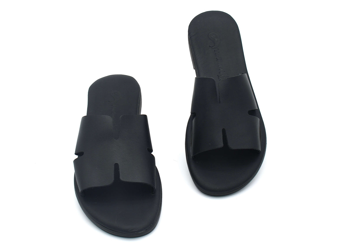 Theluto Tribeca black leather slip-on sandals with a comfortable cushioned sole and minimalist cutout design