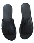 Theluto Tribeca black leather slip-on sandals with a comfortable cushioned footbed and minimalist cutout design.
